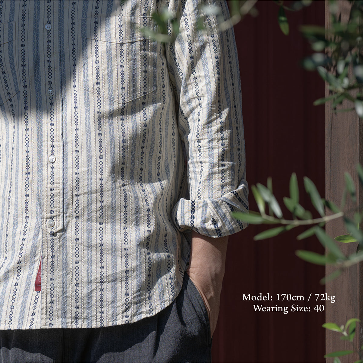 PREQUEL S1023 Classic Stripe Work Shirt (Beige), close-up of the hem and fit on a model.