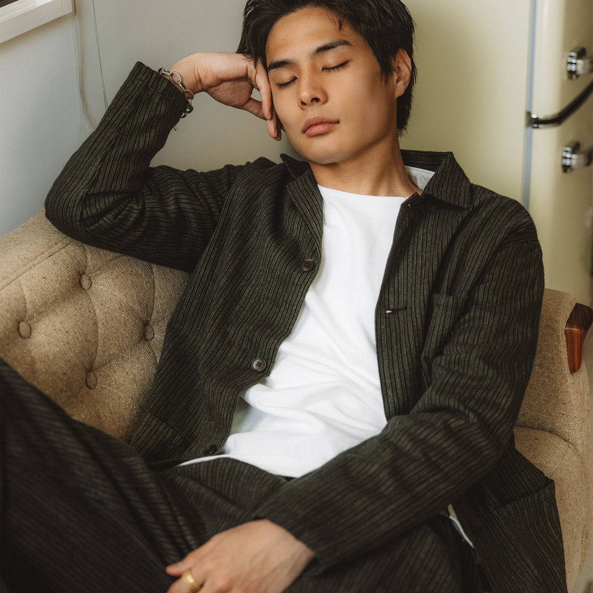 C1018 White styling reference: the long-sleeve T-shirt worn under a dark jacket.