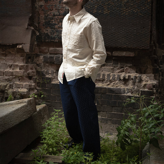 PREQUEL P1006 indigo patterned trousers styled with a light-colored shirt.