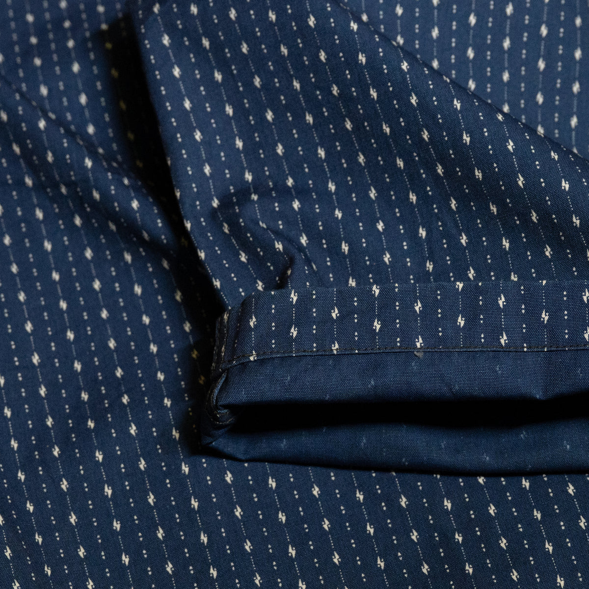 PREQUEL P1006 indigo discharge-print fabric and hem detail.