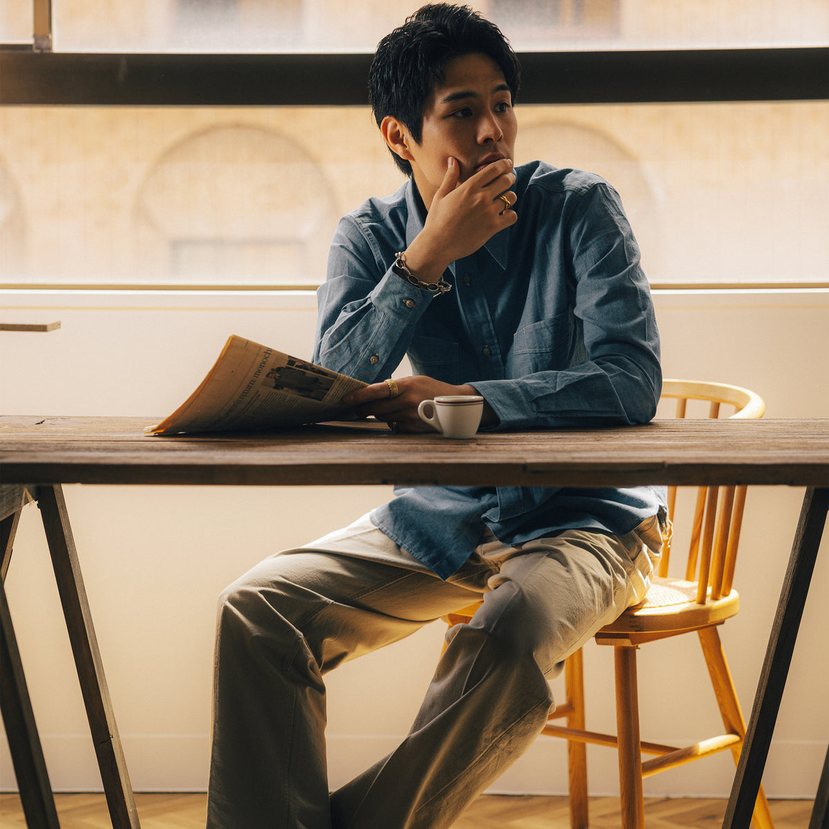 S1033 Archive Button Work Shirt in Indigo worn at a café.