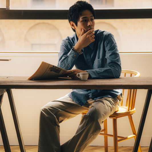 S1033 Archive Button Work Shirt in Indigo worn at a café.